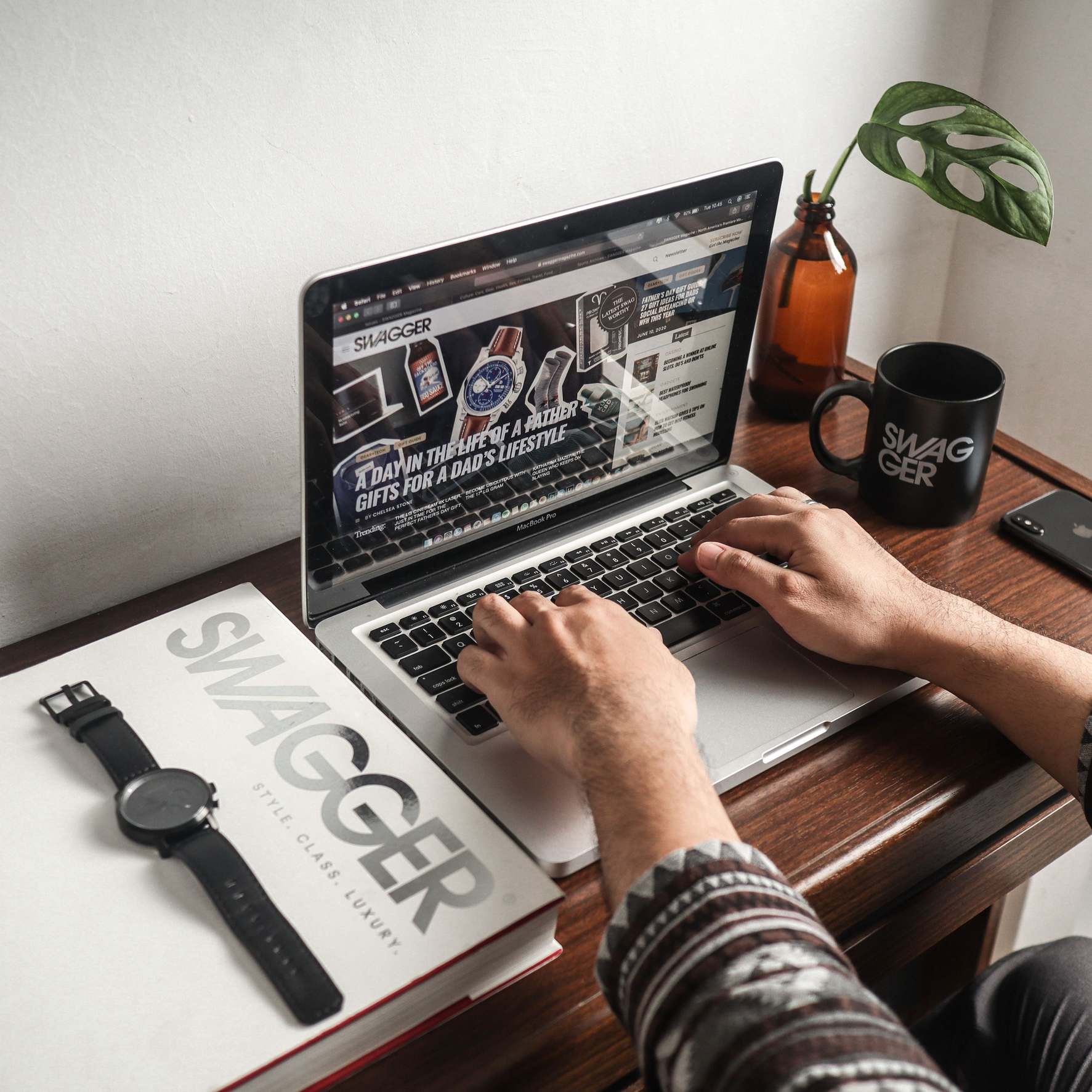 Laptop and peripherals on a desk used for software work
