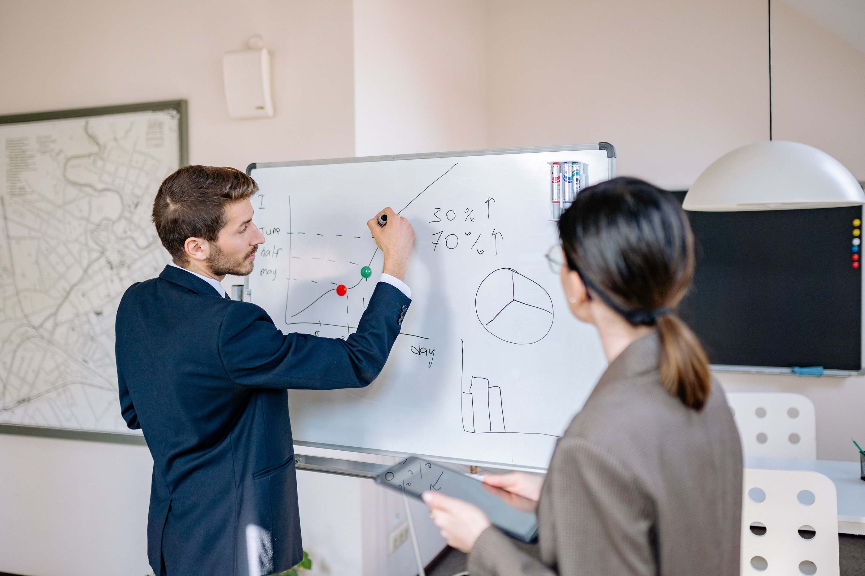 Meeting room prepared for a technical discussion with whiteboard